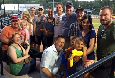 Employees from OHM Advisors gather for a Utica baseball outing.