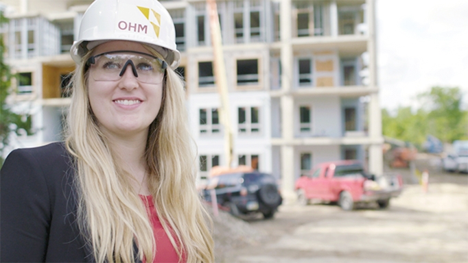 An intern on a job site during construction gets hands-on experience.
