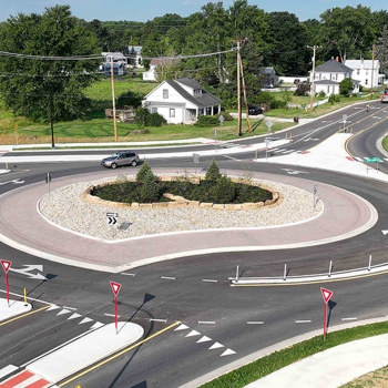 Birds-eye view of traffic flowing within the roundabout at Home Road and Lewis Center Rd in Delaware, Ohio