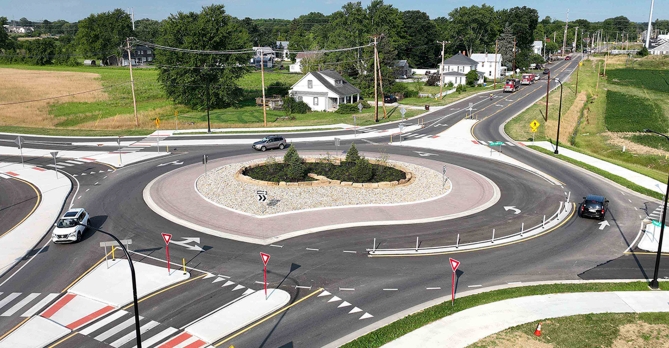 Birds-eye view of traffic flowing within the roundabout at Home Road and Lewis Center Rd in Delaware, Ohio